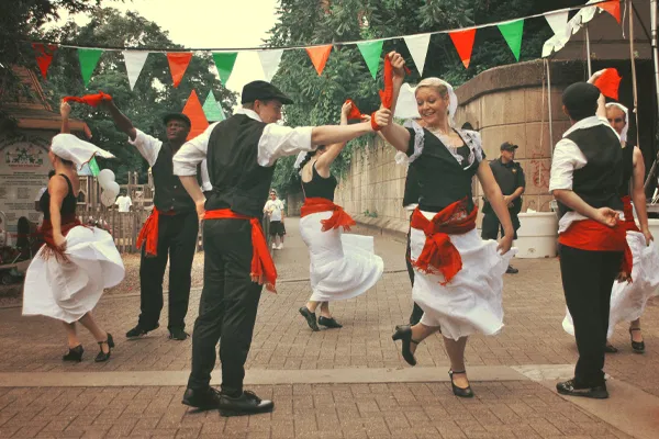 Traditional dancers performing in festive attire.