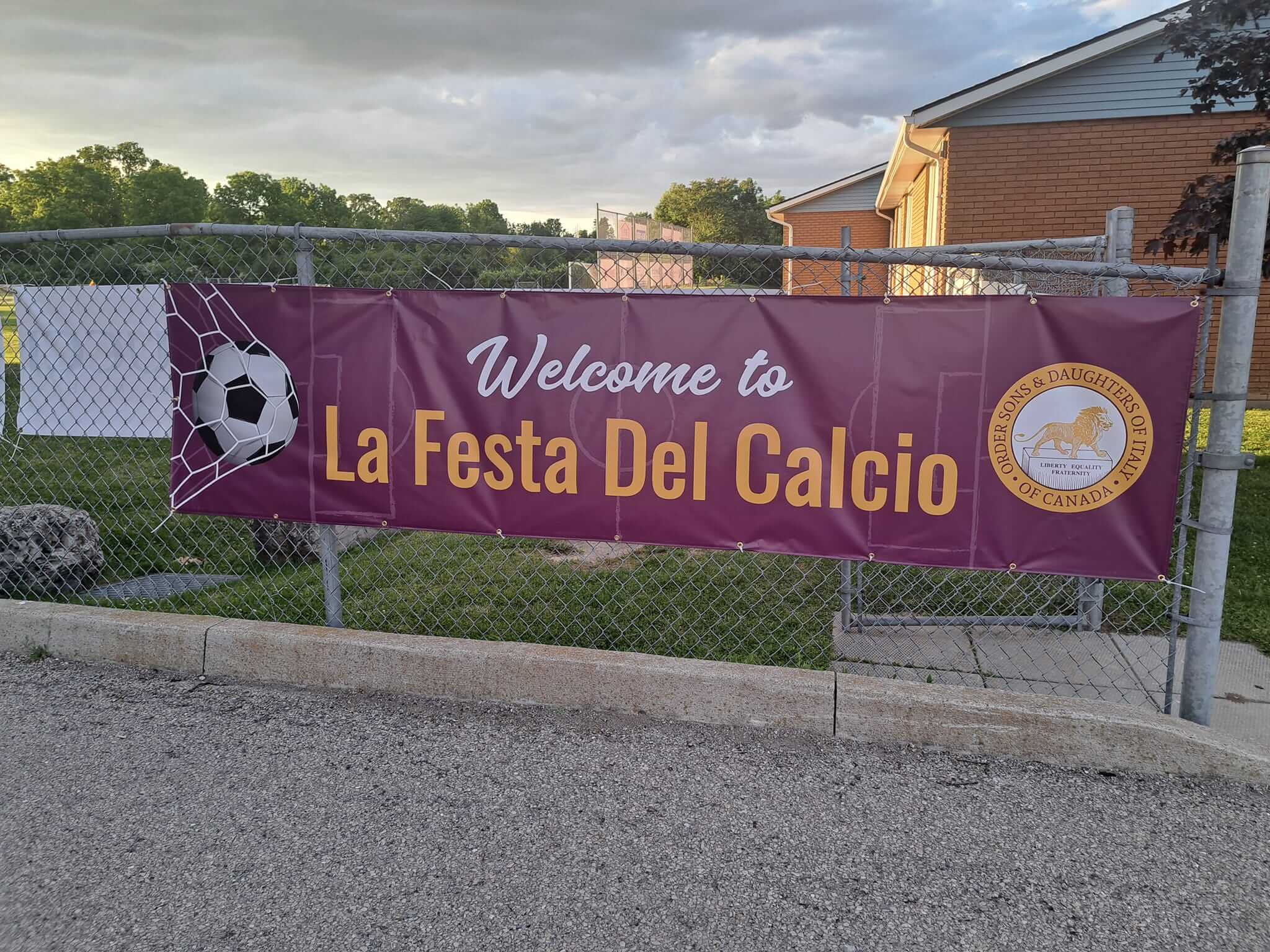 Banner welcoming visitors to La Festa Del Calcio soccer event.