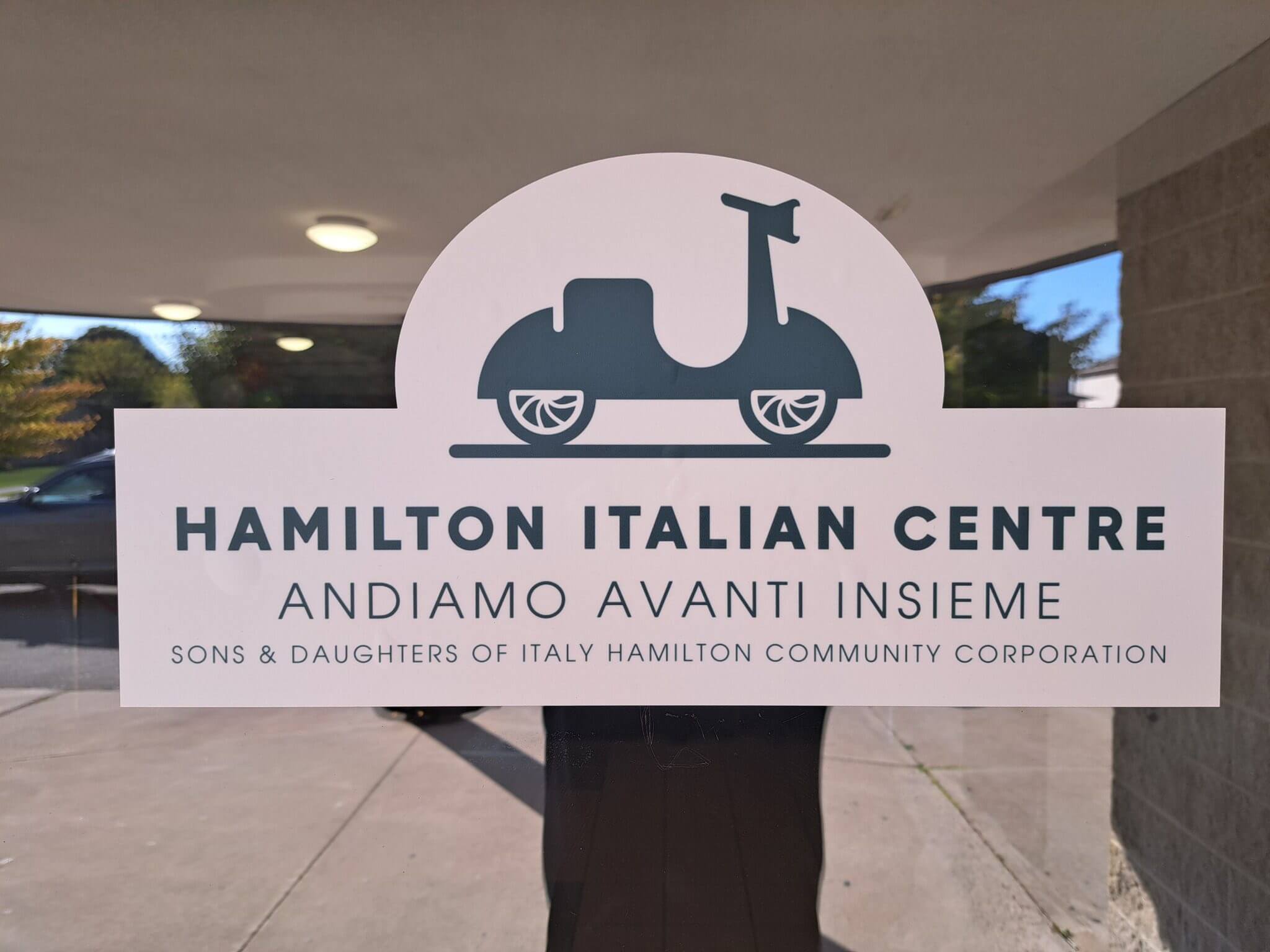 Sign for Hamilton Italian Centre with Italian and English text.