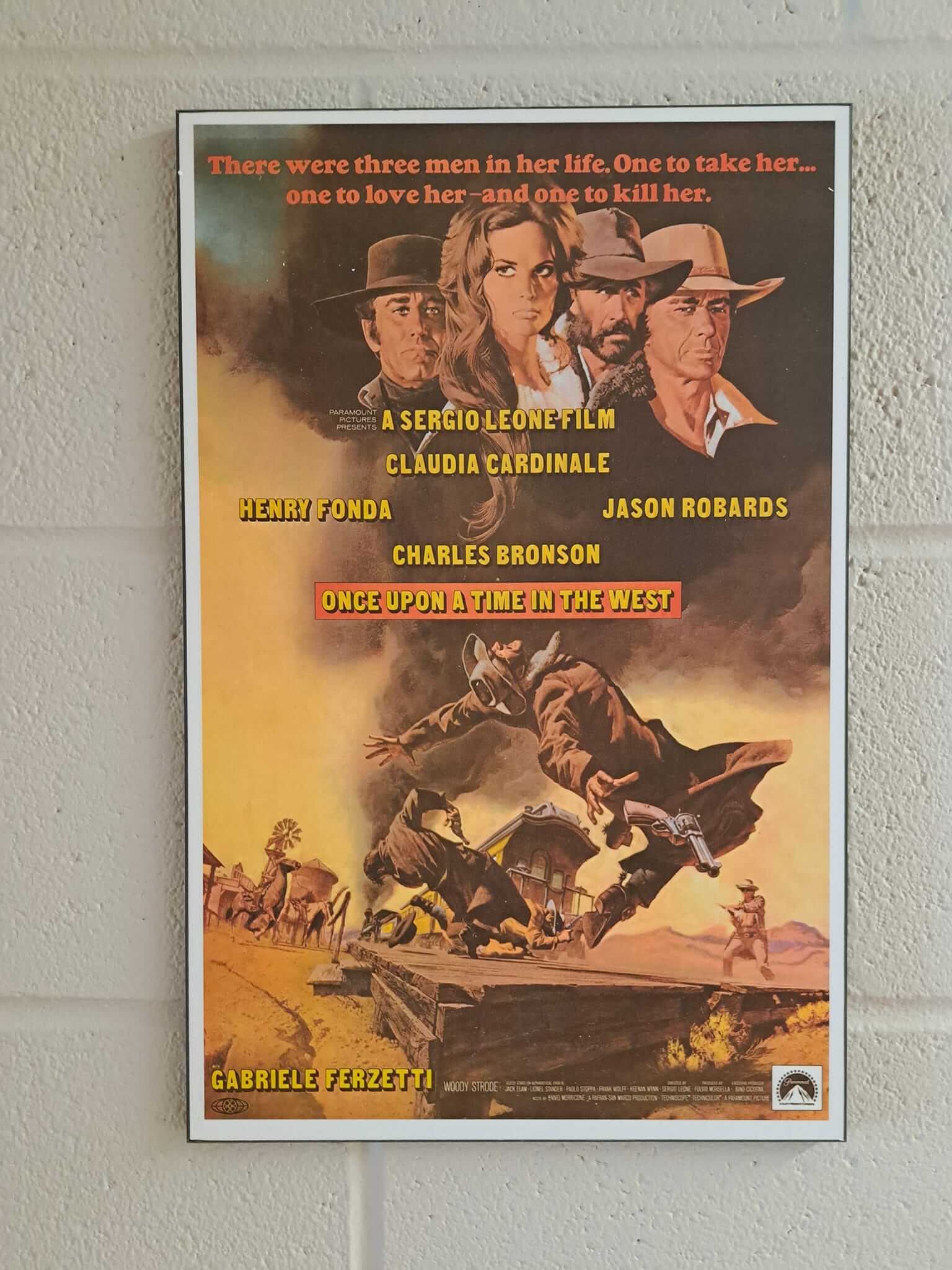 Classic western movie poster featuring four men and a dramatic horse scene.