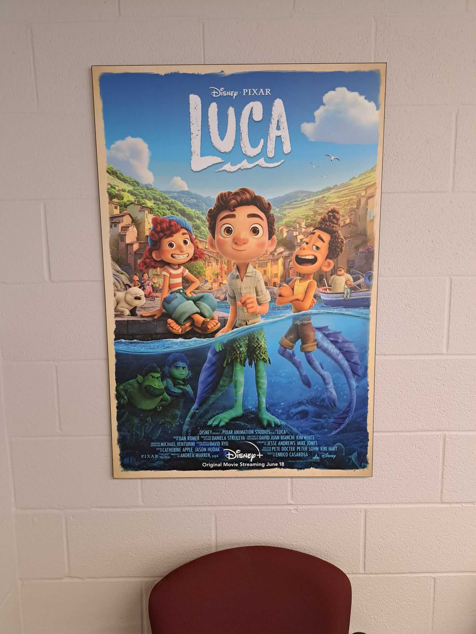 Poster of the animated film 'Luca' showing main characters on a boat.