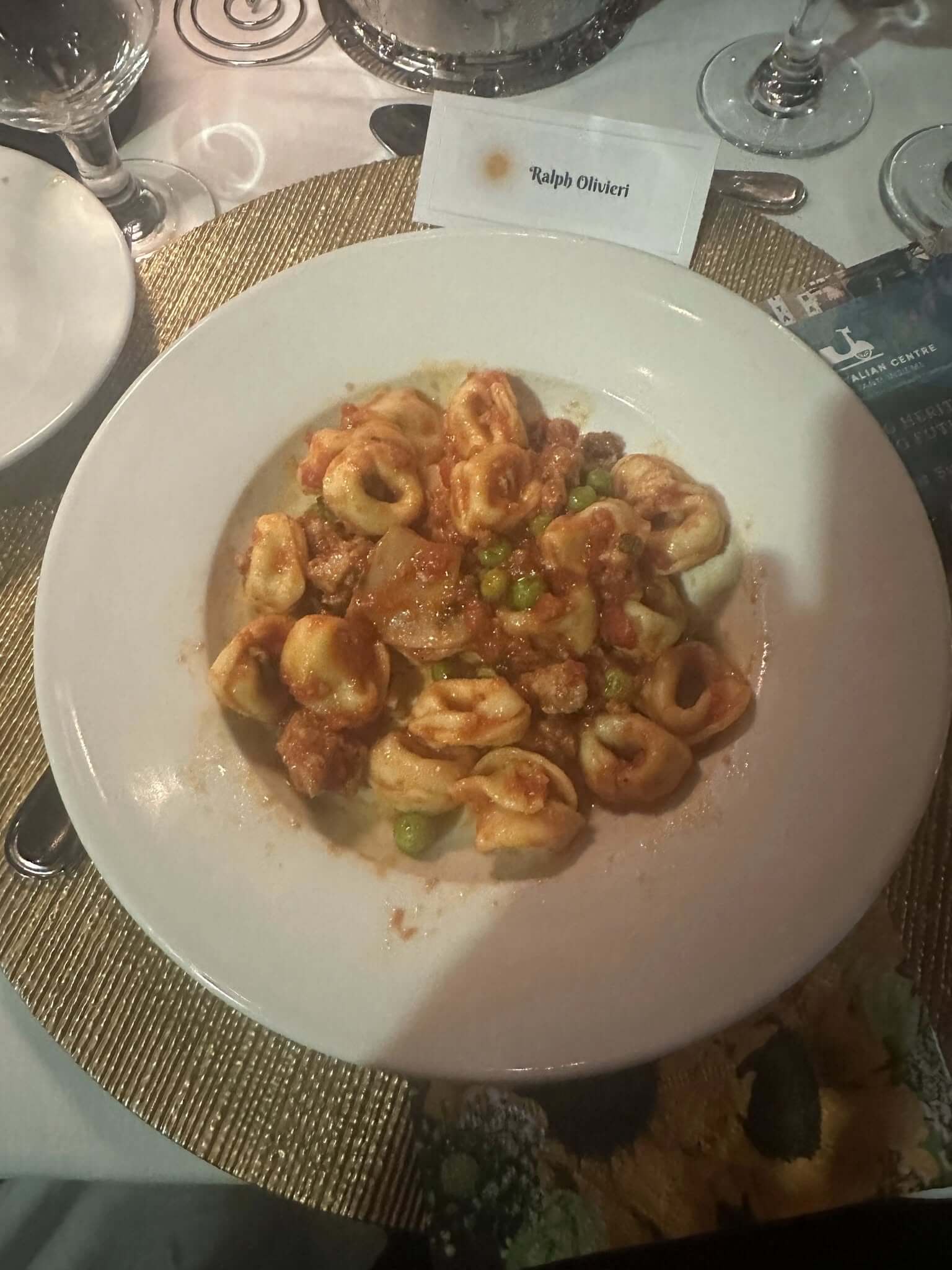 A plate of cooked shrimp garnished with herbs.